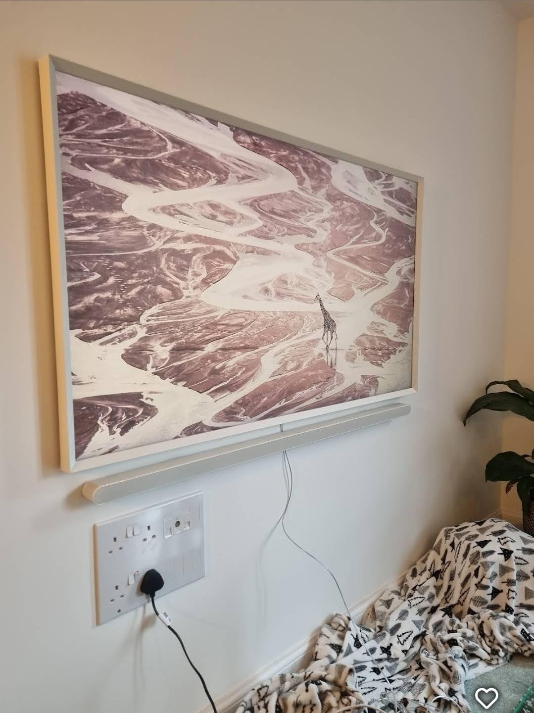 Picture and socket installed on living room wall
